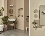 Inspireras att måla våtrum med denna harmoniska badrumsmiljö i jordnära toner, komplett med växter och en stilren komposition av material.